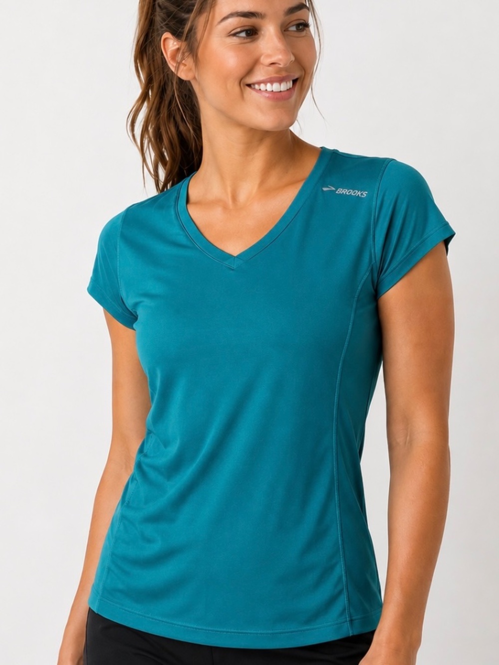 Brooks teal colored Run Happy, short sleeved t-shirt.